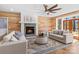 Cozy living room featuring a wood accent wall, fireplace, comfortable seating, and stylish decor at 1547 Sunset Pointe Dr, Salisbury, NC 28146