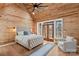 Vaulted ceiling bedroom with wood accents, natural light, and cozy sitting area at 1547 Sunset Pointe Dr, Salisbury, NC 28146