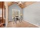 Stylish home office with wood ceiling, shiplap accent wall, hardwood floors, and a bright window view at 1547 Sunset Pointe Dr, Salisbury, NC 28146