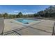 Community swimming pool surrounded by a fence and trees, creating a recreational oasis at 1547 Sunset Pointe Dr, Salisbury, NC 28146