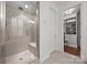 Bathroom featuring a glass-enclosed shower and access to a walk-in closet at 15913 Robbins Green Dr, Cornelius, NC 28031