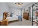 Bedroom featuring a full-size bed, a dresser, natural light, and closet with sliding doors at 15913 Robbins Green Dr, Cornelius, NC 28031