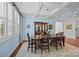 Charming dining room with hardwood floors, soft blue walls, and ample natural light at 15913 Robbins Green Dr, Cornelius, NC 28031