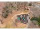 Aerial view of a community playground featuring slides, climbing structures, and walking paths in a wooded area at 15913 Robbins Green Dr, Cornelius, NC 28031