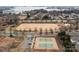 Overhead shot of tennis courts near a park and lake, perfect for active residents and outdoor enjoyment at 15913 Robbins Green Dr, Cornelius, NC 28031