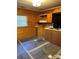 Kitchen featuring wooden cabinets, window and new flooring at 1612 Carter Rd, Lancaster, SC 29720