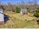 Aerial view of the expansive property with a cozy outbuilding and lush greenery at 1796 Williamsburg Dr, Rock Hill, SC 29732