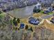 Aerial view of a beautiful home on a spacious lot with a pond nearby at 1796 Williamsburg Dr, Rock Hill, SC 29732