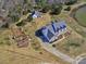 Beautiful aerial view of a home with a large yard, pond, and detached garage at 1796 Williamsburg Dr, Rock Hill, SC 29732