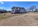 Spacious backyard view of the home featuring large windows and a covered porch at 1796 Williamsburg Dr, Rock Hill, SC 29732