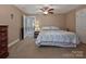 Neutral bedroom with a ceiling fan, comfortable bed, and view to another room at 1796 Williamsburg Dr, Rock Hill, SC 29732