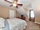 Inviting bedroom with neutral tones and a sloped ceiling with great natural light at 1796 Williamsburg Dr, Rock Hill, SC 29732