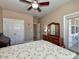 Comfortable bedroom featuring a ceiling fan, closet space, and a view outside at 1796 Williamsburg Dr, Rock Hill, SC 29732