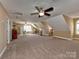 Large bonus room with neutral colors and a ceiling fan at 1796 Williamsburg Dr, Rock Hill, SC 29732