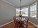 Charming breakfast nook with bay windows and wood table creates cozy dining area at 1796 Williamsburg Dr, Rock Hill, SC 29732