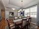 Dining area with wood table, patterned rug, and large windows for natural light at 1796 Williamsburg Dr, Rock Hill, SC 29732
