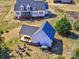Aerial view of the home featuring a covered outdoor seating area with a fire pit and shed at 1796 Williamsburg Dr, Rock Hill, SC 29732