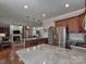 Open kitchen with granite countertops, stainless steel appliances, and hardwood flooring at 1796 Williamsburg Dr, Rock Hill, SC 29732