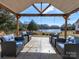 Outdoor seating area at outbuilding overlooking a serene lake at 1796 Williamsburg Dr, Rock Hill, SC 29732
