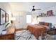 Well lit main bedroom with modern style decor, ceiling fan, and wood floors at 1839 Woodland Dr, Charlotte, NC 28205