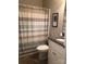 Bathroom featuring a vanity with granite countertop, tiled shower with curtain, and neutral walls at 194 Hattaway Cir, Mount Gilead, NC 27306