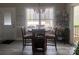 Cozy dining area with a round table set near a bright window offering outdoor views at 194 Hattaway Cir, Mount Gilead, NC 27306