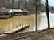 This lake view displays boat docks, boats, and a lakefront view at 194 Hattaway Cir, Mount Gilead, NC 27306
