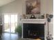 Living room featuring a fireplace and access to a deck with scenic views at 194 Hattaway Cir, Mount Gilead, NC 27306