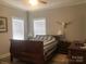 Serene main bedroom with natural light, wood look floors, and modern decor at 194 Hattaway Cir, Mount Gilead, NC 27306