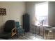 Bright office space featuring a large window, desk, decorative furniture, and neutral walls at 194 Hattaway Cir, Mount Gilead, NC 27306