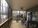 Enclosed porch with ceiling fan, screened siding, and lake views at 194 Hattaway Cir, Mount Gilead, NC 27306