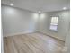 Bright bedroom with a window view and light wood-look floors at 200 Hillcrest Ave, Hickory, NC 28601