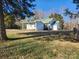 Exterior of home with covered parking, porch and grassy yard at 200 Hillcrest Ave, Hickory, NC 28601