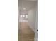 Hallway with light wood-look floors leading to a room with doors to the outside at 200 Hillcrest Ave, Hickory, NC 28601