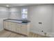 Mud room with granite countertops, cabinets, and shelving at 200 Hillcrest Ave, Hickory, NC 28601