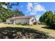 View of the rear exterior with a small porch, showcasing the home's access to the backyard at 208 Caleb Rd, Shelby, NC 28152