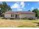 Rear exterior of the home showing a simple design with access to the yard and surrounding greenery at 208 Caleb Rd, Shelby, NC 28152