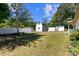Lush backyard featuring multiple storage buildings, offering practical solutions at 208 Caleb Rd, Shelby, NC 28152