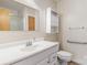 Full bathroom offering a large vanity and mirror, storage cabinet, and grab bars for accessibility at 208 Caleb Rd, Shelby, NC 28152