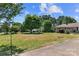 Expansive front yard leading to a charming home, creating a welcoming approach at 208 Caleb Rd, Shelby, NC 28152