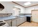 Bright kitchen with blue countertops, white cabinets, and tile backsplash at 208 Caleb Rd, Shelby, NC 28152