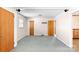 Bright living room featuring neutral walls and carpet with multiple entry doors at 208 Caleb Rd, Shelby, NC 28152