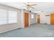 Spacious living room featuring abundant natural light and multiple entry points at 208 Caleb Rd, Shelby, NC 28152