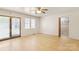 Spacious living room with a door to the backyard and a view of a closet at 208 Caleb Rd, Shelby, NC 28152