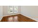 Bright bedroom with hardwood floors, white trim, fresh paint and double windows for natural light at 237 Mcneely Ave, Mooresville, NC 28115