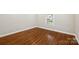 Cozy bedroom with gleaming hardwood floors, white trim, fresh paint and a window for plenty of light at 237 Mcneely Ave, Mooresville, NC 28115