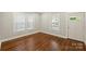 Sunlit room featuring newly refinished hardwood floors, fresh paint, and natural light at 237 Mcneely Ave, Mooresville, NC 28115