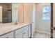 Bathroom featuring a large vanity with quartz countertop, and a tiled walk-in shower at 2811 Morning Song Way, Lancaster, SC 29720