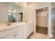 Bathroom featuring double vanity sinks, quartz countertops, and a walk-in shower at 2811 Morning Song Way, Lancaster, SC 29720