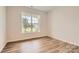 Cozy bedroom showcasing luxury vinyl plank flooring and a large window for natural light at 2811 Morning Song Way, Lancaster, SC 29720
